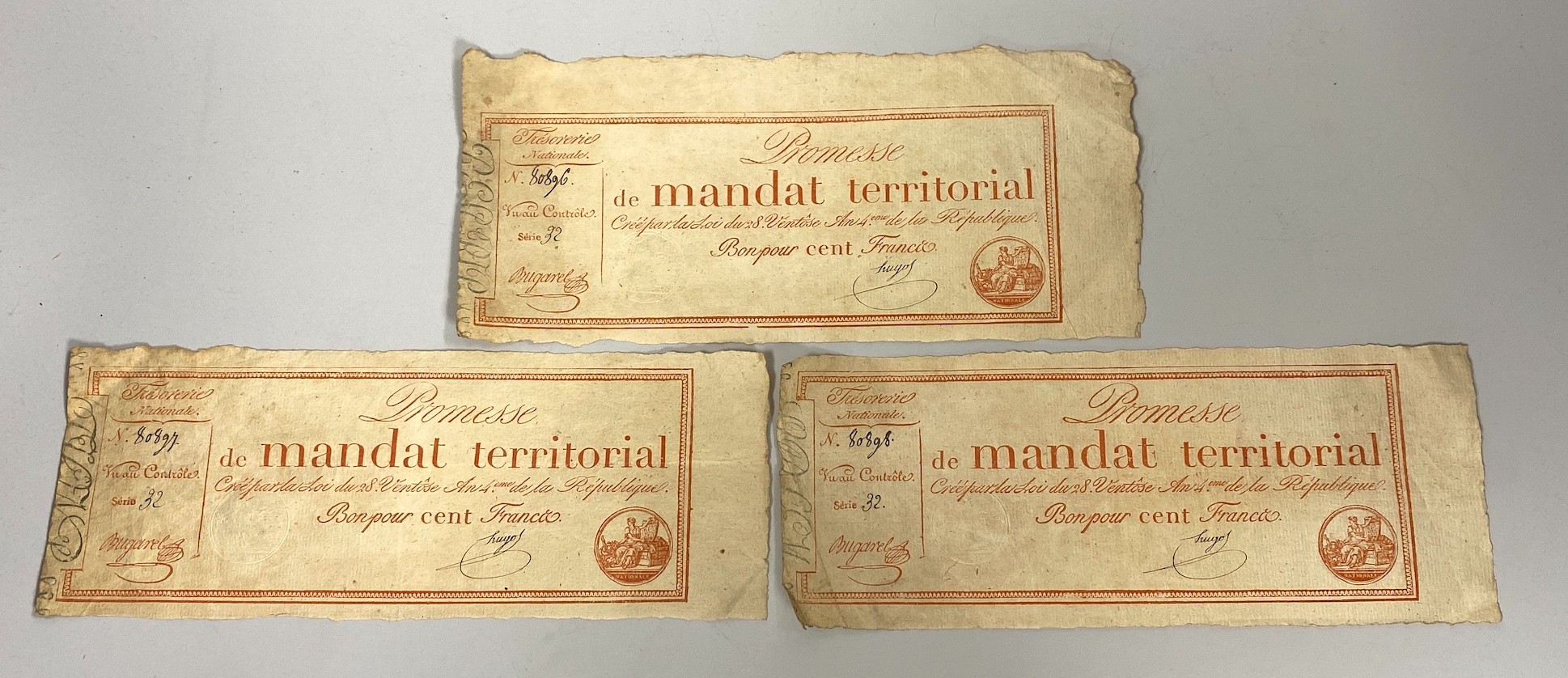 French Revolutionary banknotes, three Mandat Territorial Cent Francs No. 80896-80898, Series 32, 'Promesse De Mandat Territorial', one embossed stamp (3)